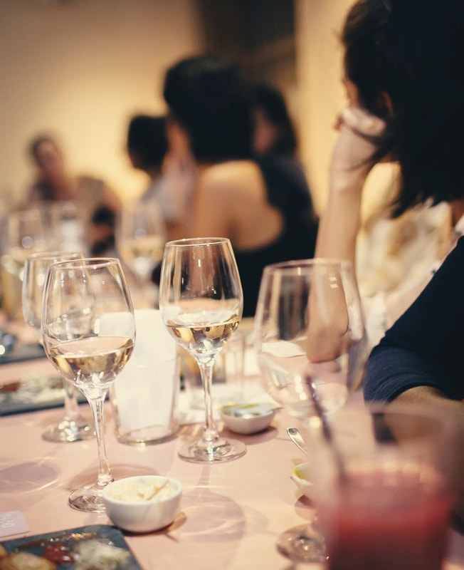 group of people eating a meal at a table